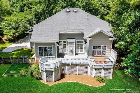 Awesome back deck for year-round entertaining! (Image/Grass is virtually enhanced)