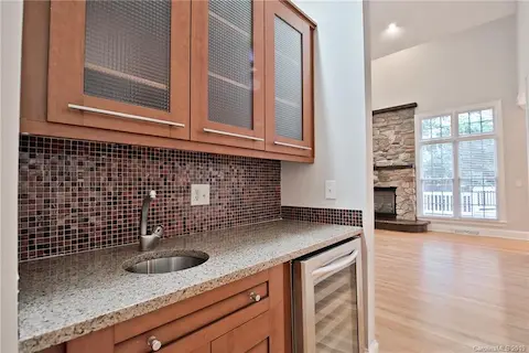 Entertaining is easy with the walk-through bar, just off of the kitchen and dining room