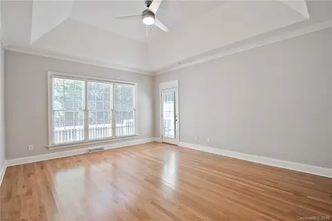 Main Level Master Suite overlooks the backyard, with access to the back deck