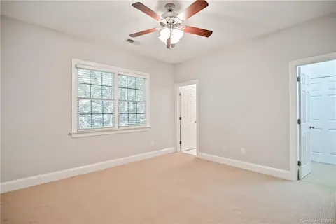 Bedroom #2 on Second Floor. This bedroom has it's own bathroom, walk-in closet, and attic access with tons of storage space!