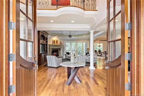 Beautiful double door entrance to a grand two story foyer and large great room.