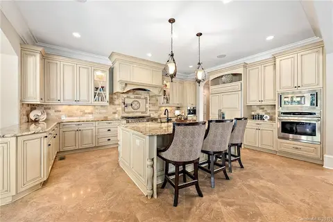 Warming drawer below wall oven.  Large pantry has ample storage.