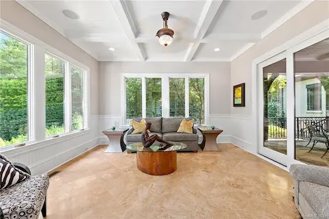 The gorgeous sunroom brings the outside in.
