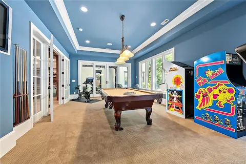 Billiards/exercise room in basement.  This room has access to covered porch and pool area.  Large closets to store weights, exercise mats and work out equipment.