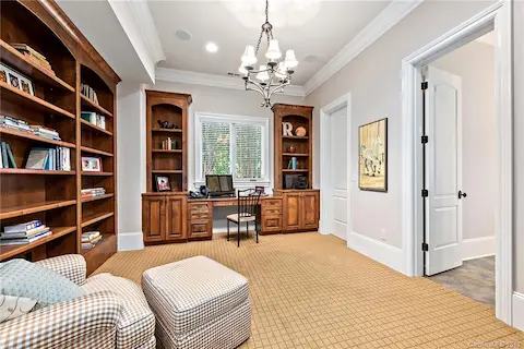 Downstairs office with built ins.  Jack and Jill bathroom for this office, downstairs bedroom and the pool.