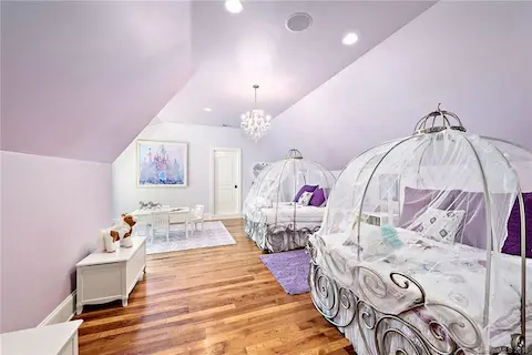 Upstairs bedroom/bonus room has gorgeous hardwood floors.  Large playroom or storage area through the pictured door.  Full bathroom.