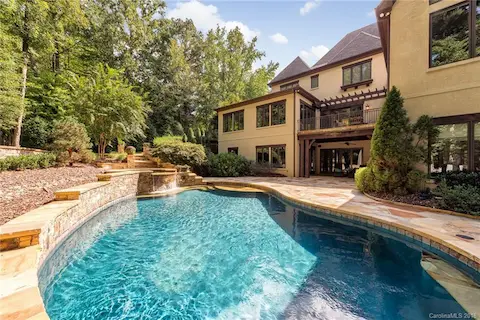 Beautiful mature trees make this outdoor living extra gorgeous.