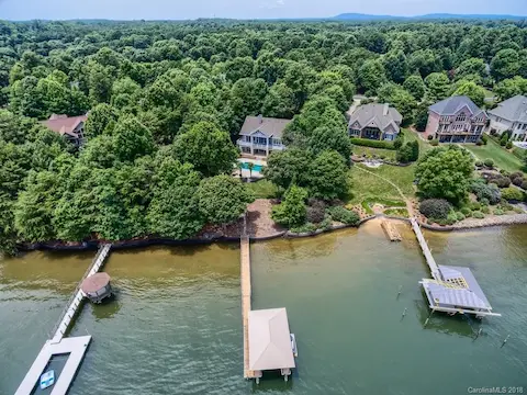 Spectacular Waterfront Home!  This one has it all!   Must see - main channel beauty on the shores of Lake Norman.  In-Ground pool, Finished basement w/ bar, Private dock and pier, and so much more. Must see today!
