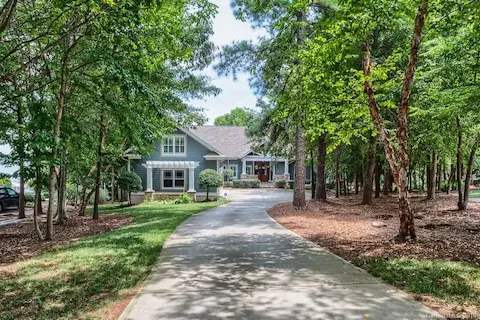 The home is set back from the street, makes for a very private setting....Must see - main channel beauty on the shores of Lake Norman.  In-Ground pool, Finished basement w/ bar, Private dock and pier, and so much more. Must see today!