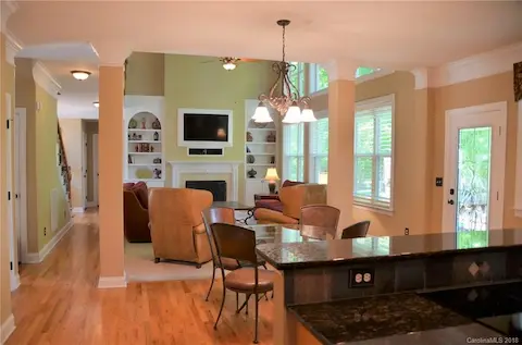 Built in bookcases on either side of fireplace.