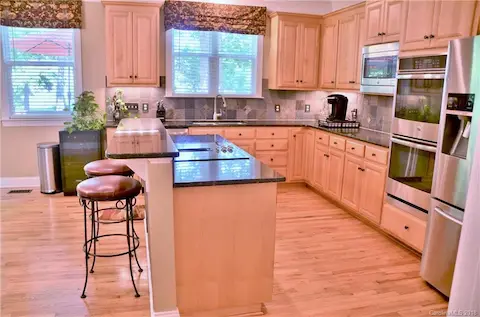 Brand new stainless steel appliances including a double oven.