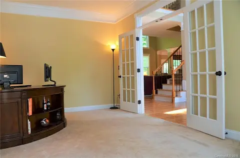 Main level office with french doors.