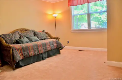 First floor guest bedroom with a full closet and full bathroom.