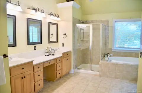 Master bath with double vanity.  deep soaking tub and separate shower.