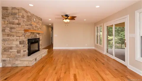 The stacked stone fireplace is just the place you will want to be on those cooler days when being indoors and looking at the lake is where you will want to be.