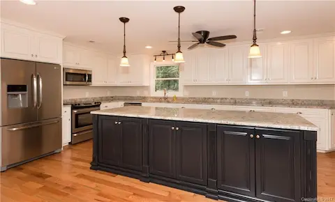 This kitchen was beautifully renovated and has great storage, counter space and seating for casual dining. Open to the great room and has awesome views of the lake