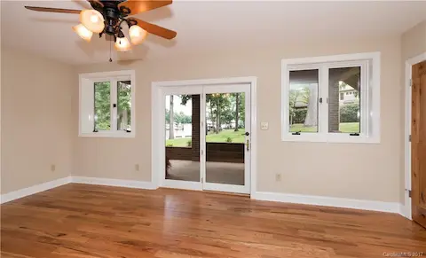Basement level great room or rec room has direct entry to a covered patio and easy access to the lake and pier and slip that will come with the house.
