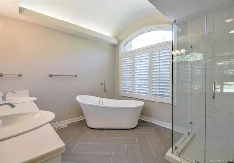 Upgraded master bath with dual vanity, soaking tub & separate shower