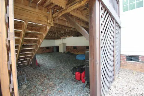 Not only is there space under this deck to store item - but the crawl space also has walk in storage!
