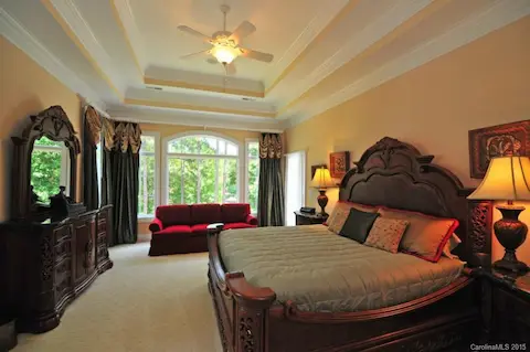Great Master Suite with wall of windows offering an incredible view of Lake Norman!