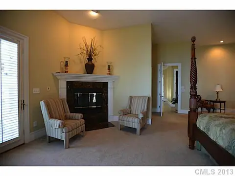 Master Bedroom - Master Bedroom has a gas fireplace, sitting area, large walkin closets and is lakefront