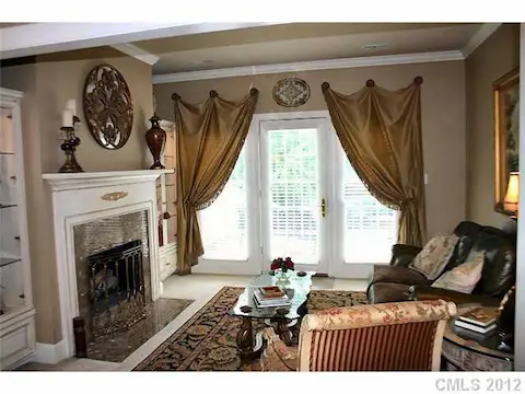 Master Bedroom - Gorgeous master bedroom sitting area with fireplace and balcony overlooking backyard oasis