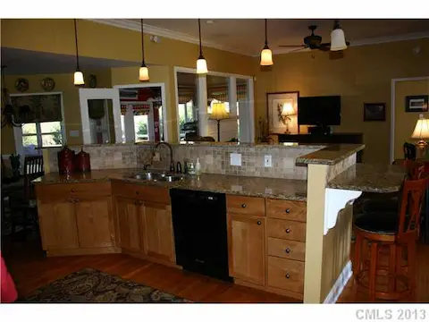 Kitchen - Large Work Area.  Granite Countertops.  Bar Seating.