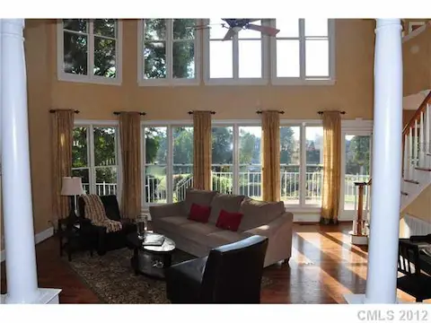 Living Room - Beautiful views of Palm trees and Lake Norman greet you everytime you walk through the door.