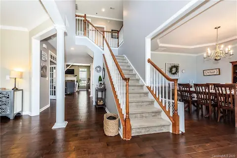 Gorgeous entryway.....New 5 inch prefinished wood flooring throughout first floor!