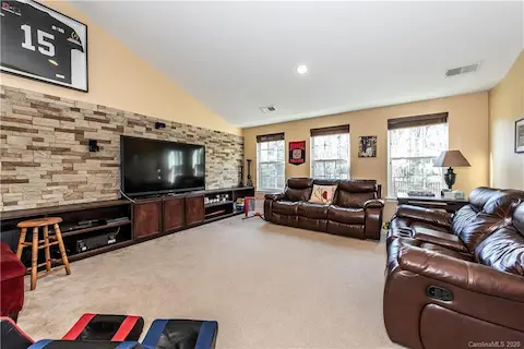 Bonus Room with Vaulted Ceilings - Custom Built Ins and a STUNNING AIRSTONE wall