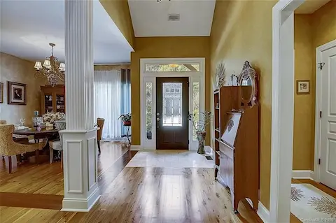 2 story entry way show casing the beautiful hardwood floors & open floor plan!