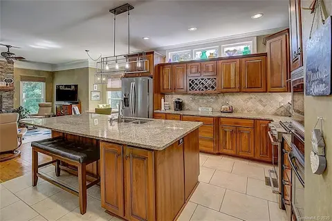 Enjoy cooking your favorite meal in this very spacious kitchen w/a huge island and open to the keeping room