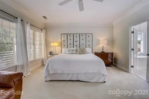 Extra spacious primary bedroom with a sitting area