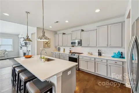 Kitchen with GE stainless appliances.