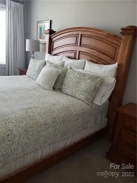 Primary bedroom with furniture.