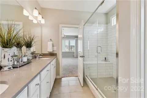 Glass seamless shower in primary.