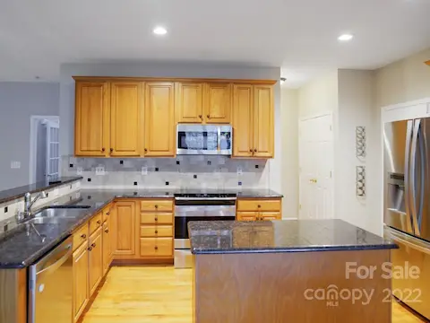 Includes granite, ss appliances and tumbled stone backsplash