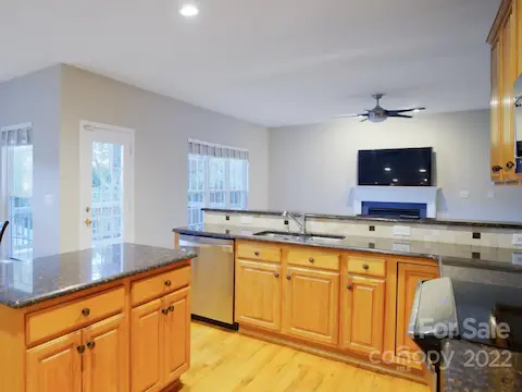 Kitchen, Dining Room and office with wood flooring