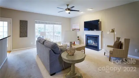 Great room with plenty of natural light and gas fireplace