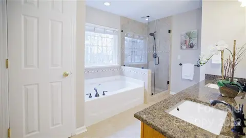 Spa like bath, dual sinks, oversized soaking tub, stand up shower with frameless shower door