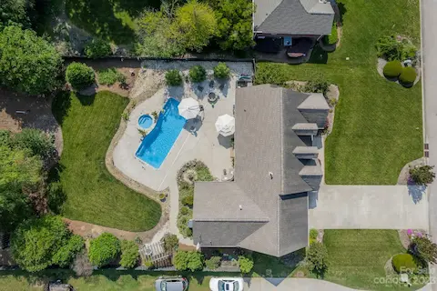 Aerial view which shows the entire lot has been landscaped and manicured!  Backyard resort!