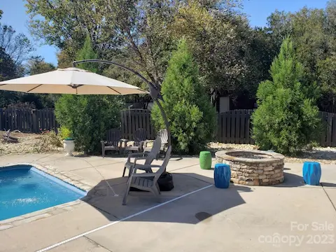 Note the double sided custom arched fence that surrounds your huge backyard paradise!
