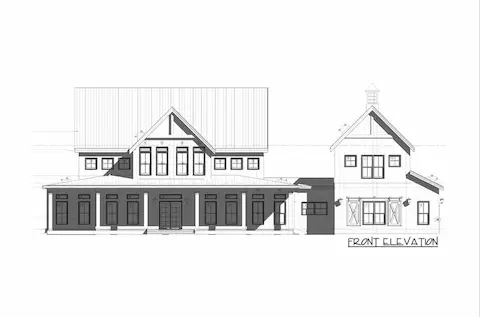 Symmetrical design and classic proportions, complete with a welcoming covered porch, tall vertical windows, and a detached-style side wing with barn-style shutters and a cupola-topped gable.