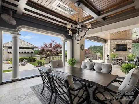 Outdoor dining area with retractable screens