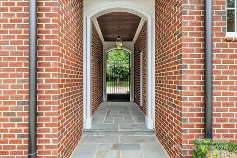 Covered Breezeway from garage to pool house.