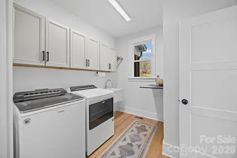 Spacious laundry room- sink, storage- located right outside Primary on main level