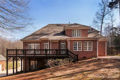 29' deck with entry from sunroom/dining room and brick walkway to patio/firepit.  Stained (2 coats) in 20261