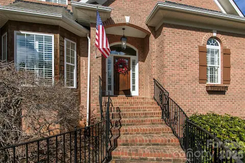 Welcome to 4709 Trey View Ct - brick walkway/steps to custom wood door.