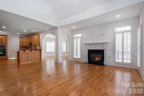Open floorplan brings living/family room, sunroom or dining area and kitchen ready for family and friends.  Arched openings, rounded corners ALL 3 levels - Custom wood shutters ALL 3 levels AND garage!.