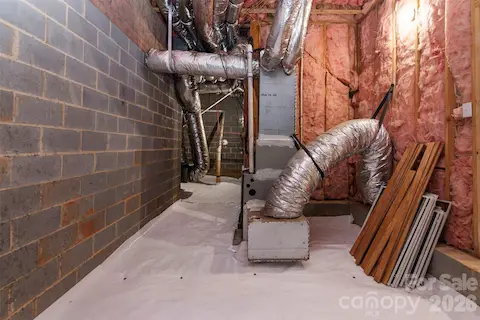Crawlspace - new 15 mil poly and new dehumidifier on elevated level - all by Cardinal Environmental.  Controlled area for extended storage (window screens/additional engineered hardwood  now stored near entry)